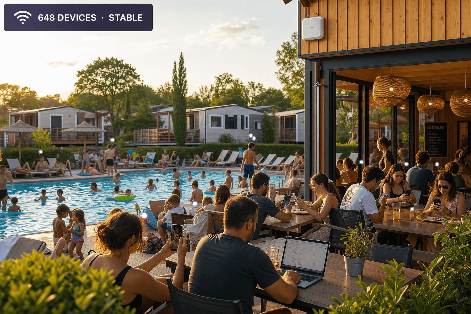 Piscine et terrasse de camping très fréquentées avec de nombreux appareils connectés simultanément à une borne Wi-Fi outdoor
